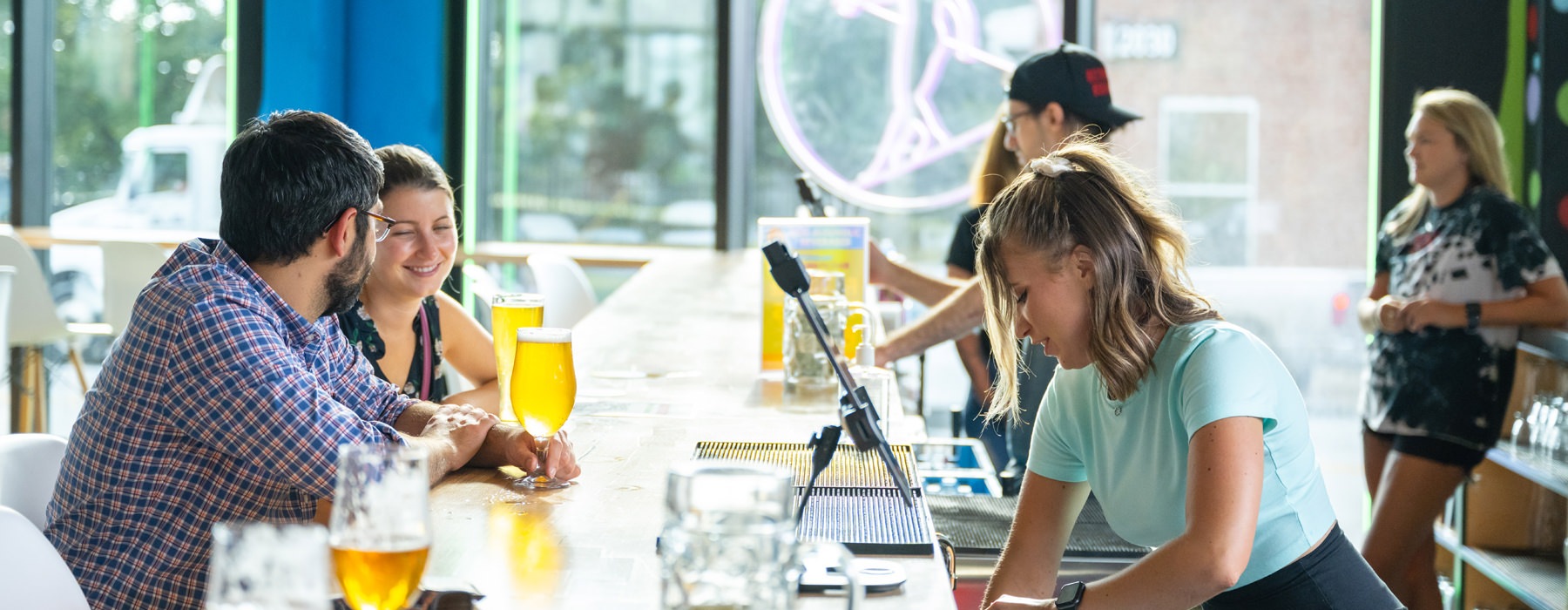people having drinks at a bar